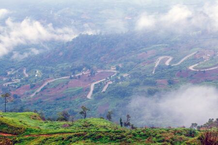 morning view point with mountain mist and road in phu tubberkの写真素材