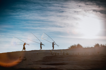 Fisherman on sunset.vintage styleの写真素材