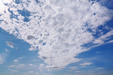 Big white cloud on blue clear sky at sunny summer dayの写真素材