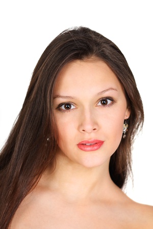 Pretty brunette girl looks at camera isolated on white backgroundの写真素材