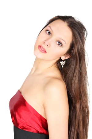 Brunette girl wearing red dress looks at camera isolated on white backgroundの写真素材