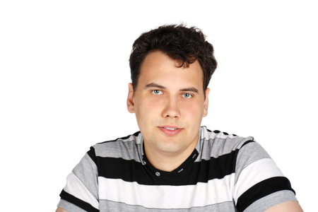 Portrait of brunet handsome smiling man isolated on white background.の写真素材