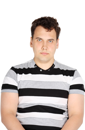 Portrait of brunet handsome serious man isolated on white background.の写真素材