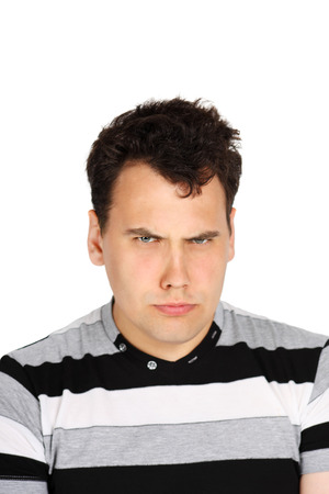 Portrait of brunet handsome suspecting man isolated on white background.の写真素材