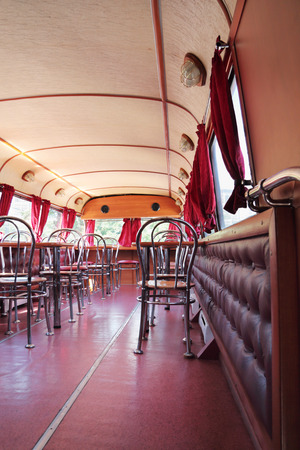 PERM, RUSSIA - JUN 11, 2013: Tables of bus cafe Kentucky Fried Chicken. First restaurant KFC was opened in 1930のeditorial素材