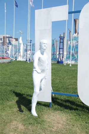 PERM, RUSSIA - JUN 11, 2013: White silhouette of a man near the big letters at the festival White Nights in Permのeditorial素材