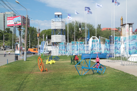 PERM, RUSSIA - JUN 11, 2013: Collection of colored decorative metal bike at entrance to town of White Nights in Permのeditorial素材