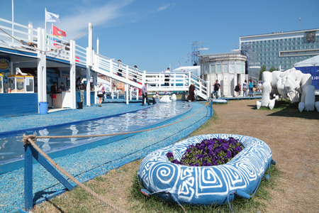 PERM, RUSSIA - JUN 11, 2013: Decorative water channel and deck in festival town White Nightsのeditorial素材