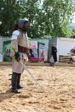 PERM, RUSSIA - JUNE 25, 2014: One fencer with a sword in his hand on sand at festival White Nightsのeditorial素材