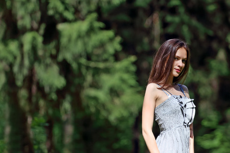 Close up to the waist of beautiful girl in dress with shallow depth of fieldの写真素材