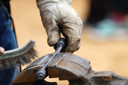Closeup of blacksmith hand brushed metal forged products outdoorの写真素材