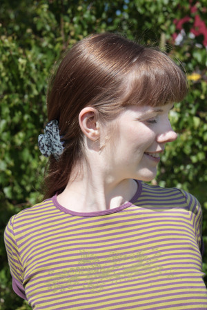 Pretty woman haves fun with closed eyes at summer day outdoorの写真素材