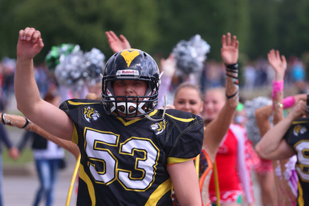 PERM, RUSSIA - JUN 12, 2015: Rugby player in helmet at street during day of Russiaのeditorial素材