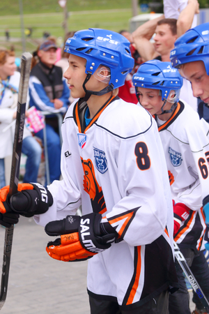 PERM, RUSSIA - JUN 12, 2015: Boys hockey players of club Molot at street during day of Russiaのeditorial素材
