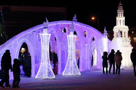 PERM, RUSSIA - JAN 4, 2016: People walk in illuminated Ice town, Ice town in Perm - traditional winter attractionのeditorial素材