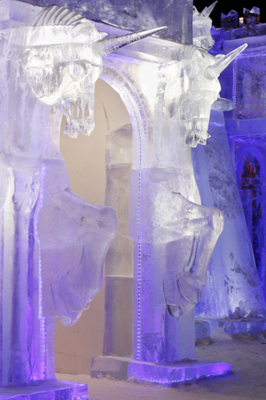 PERM, RUSSIA - JAN 4, 2016: Illuminated gate with unicorns in Ice town, Ice town in Perm - traditional winter attractionのeditorial素材