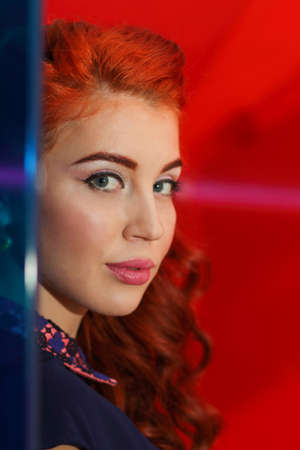 Young woman with beautiful long wavy hair and captivating looks forwardの写真素材