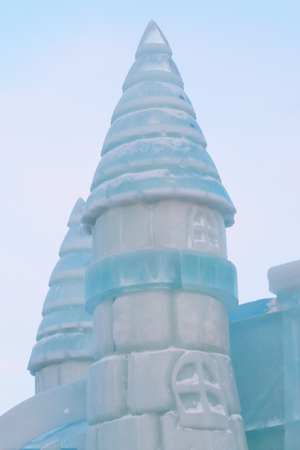 Part of ice fairytale castle with towers outdoor at winter frost dayの写真素材