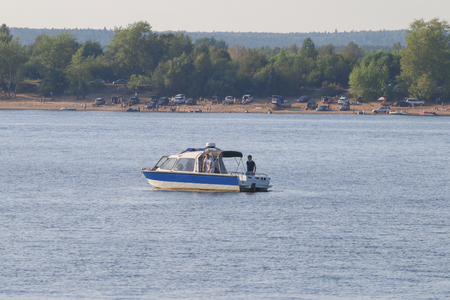 Boat of the Maritime police in charge of the beach which attracted many people to rest on the shore on a warm dayのeditorial素材