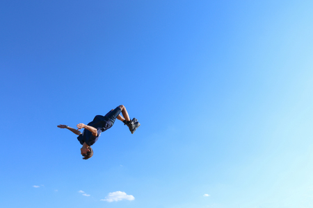 PERM, RUSSIA - August 20, 2016: Young man in blue denim breeches jumps during the event, the...