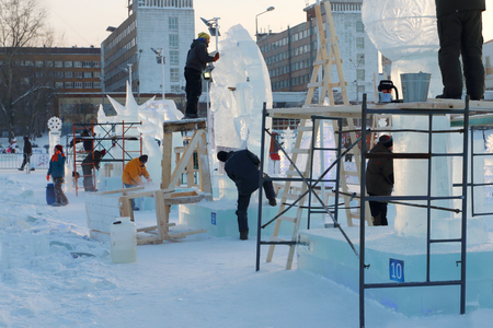 PERM, RUSSIA - JAN 18, 2017: Artists make ice sculptures in Ice town, Perm Ice Town 2017 Ekosad - largest in Russiaのeditorial素材