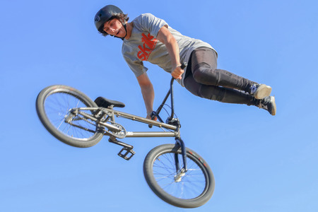 PERM, RUSSIA - August 20, 2016: Young man in a protective helmet on his head jumping in aeromat at...