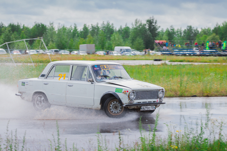 PERM, RUSSIA - JUL 22, 2017: Drifting white car move on wet asphalt track at Open Ural Championship Drift 2017のeditorial素材