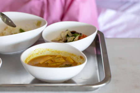 The doctor with PPE suit, Doctor is using a test coronavirus(covid-19) with the use of an ATK test kit by nasal swab.の写真素材