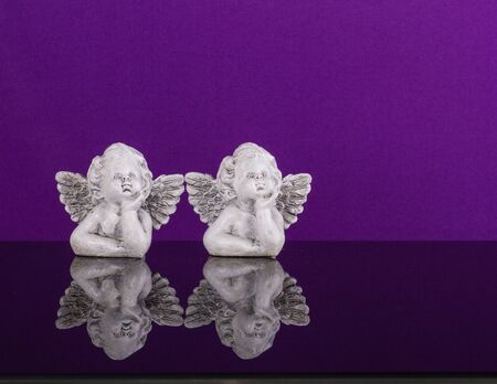 Christmas decoration. Two figurines of dreamily angels twinの写真素材