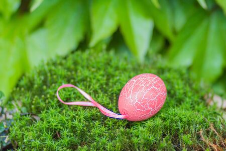 Easter  naturel green background with pink egg with texture of craquelure.の写真素材