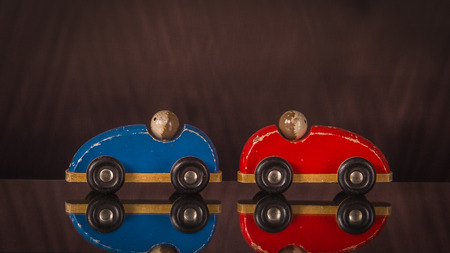 Concept communication and development of child. Two toy cars are in different directions.の写真素材