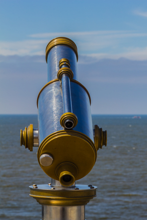 Operated Binocular on the coast of  North Sea outdoor in Netherlandsの写真素材