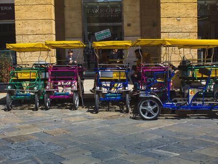 Men of Rickshaw Rental in all colors on the square.