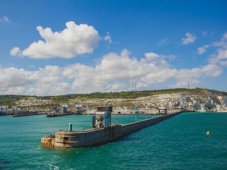 beautiful seacoast with haven of Dover Port.Ferry coming in to dock at Dover Port.の写真素材