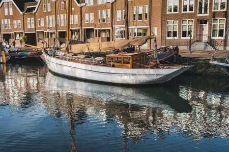 Beautiful reflection of sailing boat in water.