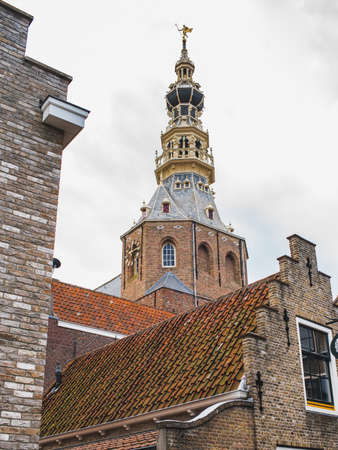view of the church in the center of Zierikzee between typical old Dutch small houses, Zeeland / Netherlandsの写真素材