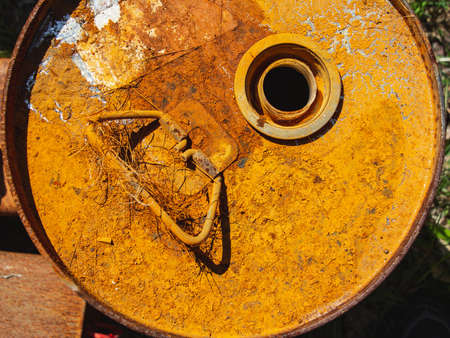 metal rusty barrel, textured rusty metal background, open lid on rusty grunge texture of old metal fuel or liquid chemical tank, galvanized steel oil tank that weathered corrosion.の写真素材