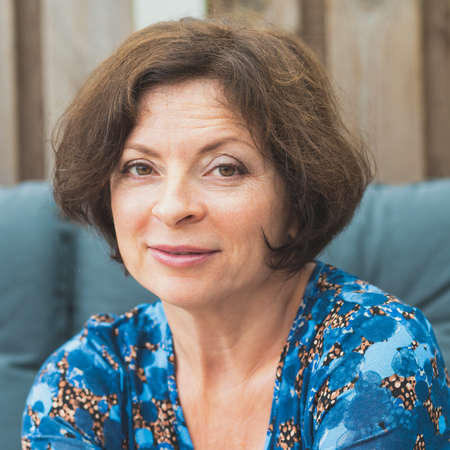 Portrait of an attractive cute woman in her 60s with an incredulous look.の写真素材
