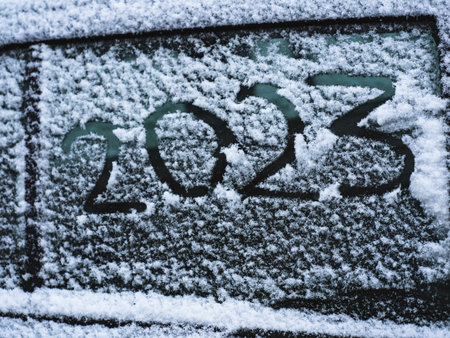 Winter, window car in snowflakes the number 2023 is written in the snow.の写真素材