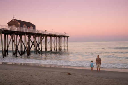 Belmar, United States - August 7, 2016: People enjoy seashore landscape on the Belmar Beach in a weekend eveningのeditorial素材