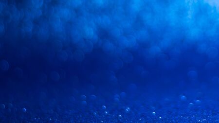 abstract background with blue bokeh, lights and shadow.の写真素材