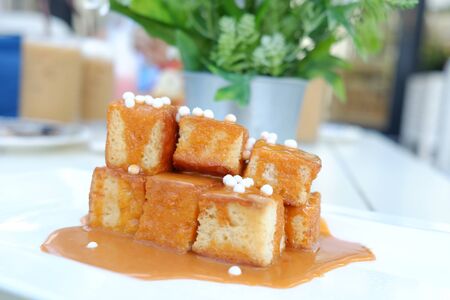 Mini toast, bread topped with Thai milk tea.の写真素材