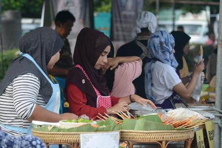 3rd Muslim Thai Fair 2017 held in Plaza street Huamark indoor stadium showcased various local products and services from clothing, food, beverages and different private companies.のeditorial素材