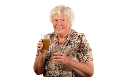 Senior lady with healthy drinksの写真素材