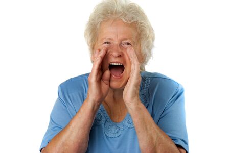 Senior woman is shouting loud, on white backgroundの写真素材