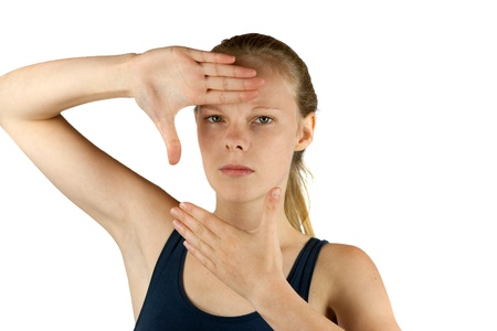 Young woman making frame with her fingersの写真素材