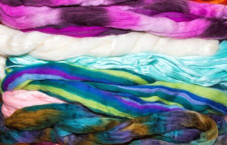 Stack of various natural fibers woven into fleece materialの写真素材