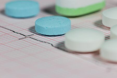 medical electrocardiogram  report with several pillsの写真素材
