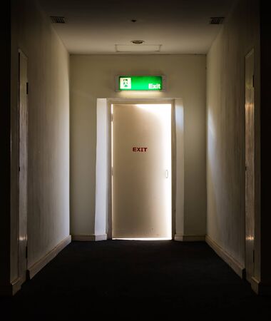 emergency fire exit outlet sign and doorの写真素材