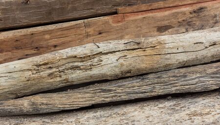 pile of recycle old wooden pole